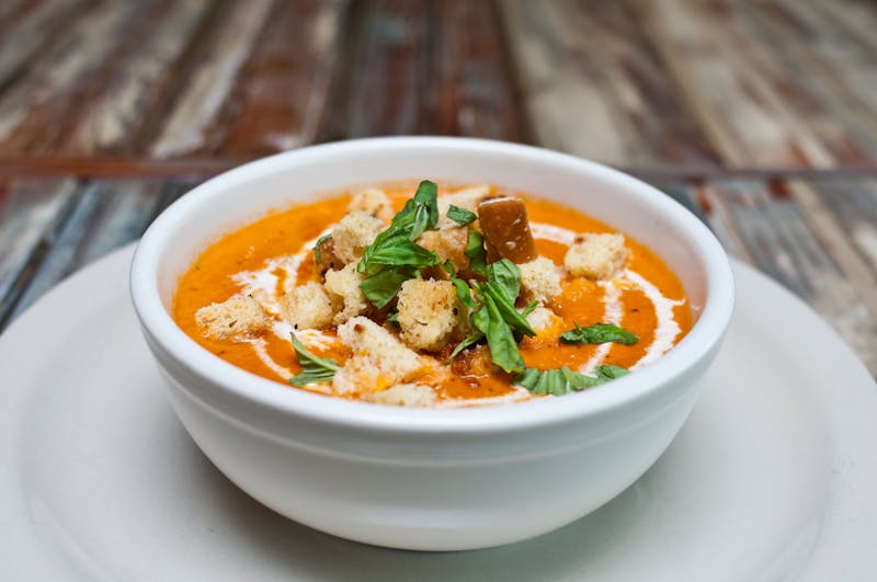 Dions Tomato Soup cup served with croutons